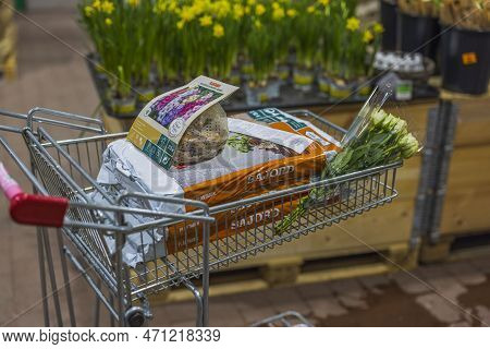 Close Up View Of Trolley In Store With Purchased Garden Supplies For Planting Plants In Vegetable Ga