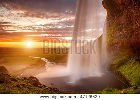 Godafoss is a very beautiful Icelandic waterfall. It is located on the North of the island not far from the lake Myvatn and the Ring Road. This photo is taken after the midnight sunset