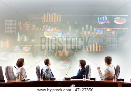 Image of businesspeople at presentation looking at virtual project