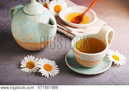 Hot Camomille Tea With Honey In Handmade Ceramic Cup