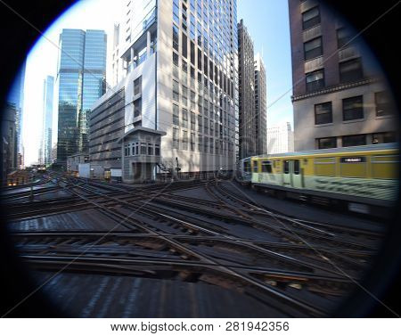 Commuter Train Turning The Corner On An Elevated Train Track Railroad Track Interchange Surrounded B