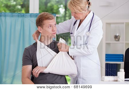 Doctor And Patient With Broken Hand