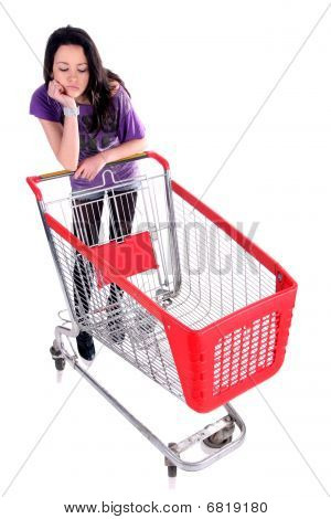 Unhappy Girl With Shopping Cart