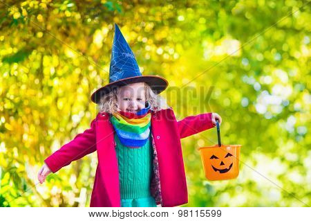 Little Girl In Witch Costume At Halloween