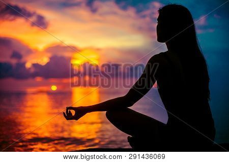 Woman Meditating, Relaxing In Yoga Pose At Sunset, Zen Meditation