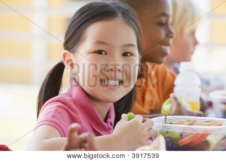 Students Outdoors Eating Lunch (Selective Focus)