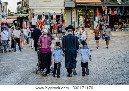 Jerusalem/israel- August 17, 2016: Orthodox Jewish Family Walking Together Among Tourists At Jaffa G