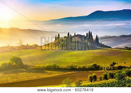 Tuscany foggy landscape at sunrise, Italy