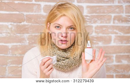 Nasal Spray Runny Nose Remedy. Girl Sick Person Hold Nasal Drops And Tissue. Allergy Concept. Home T