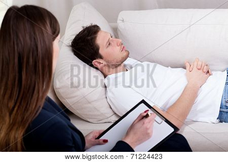 Therapist Working With Patient On Hypnosis