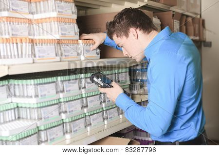 A Pretty warehouse manager checking the inventory