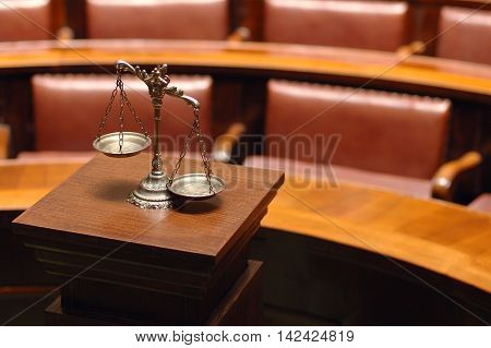 Symbol of law and justice in the empty courtroom law and justice concept.