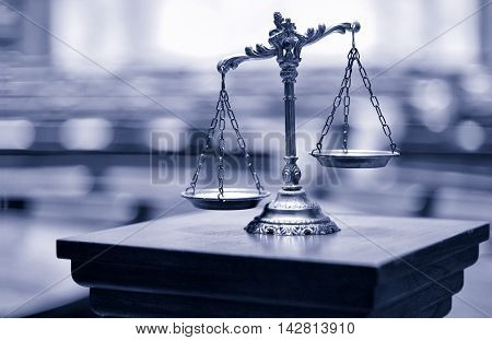 Symbol of law and justice in the empty courtroom law and justice concept.