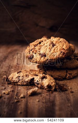 Chocolate Chip Cookies On Wooden Background. Stacked Chocolate Chip Cookies Shot With Selective Focu