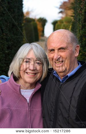 Day out for a senior couple in formal gardens.