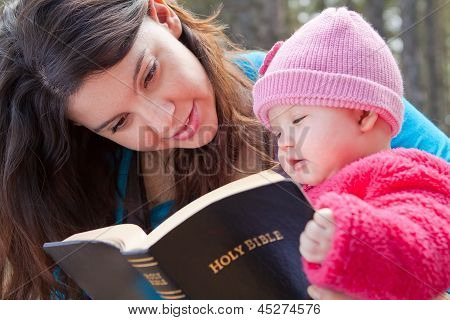 Mom And Baby Daughter Reading Bible