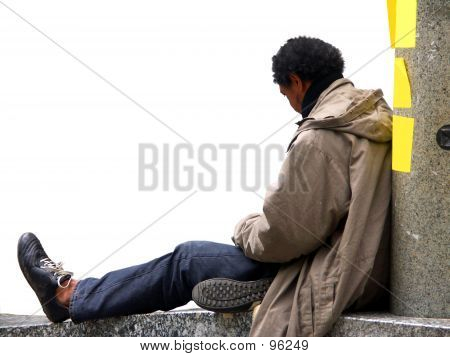 Man Sitting On A Wall