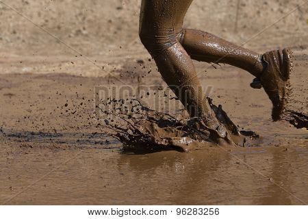 Mud race runner's muddy feet