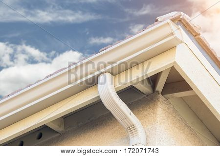 House with New Seamless Aluminum Rain Gutters.