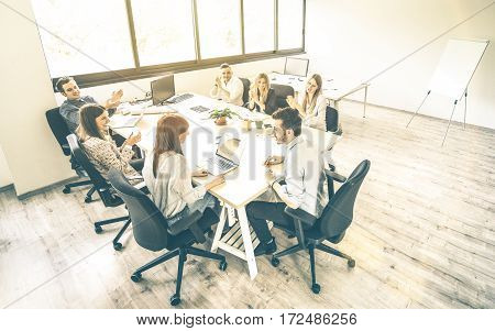 Group of young people employee coworkers at business meeting in urban coworking place studio - Human resources concept at working time - Start up entrepreneurs at office - Bright desaturated filter