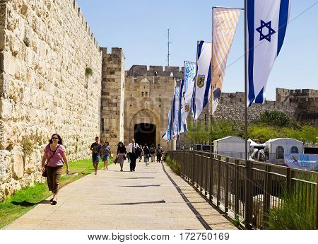 JERUSALEM ISRAEL - CIRCA SEP 2016: Alley leading to the Jaffa Gate. Tourists at the entrance to the Jaffa Gate