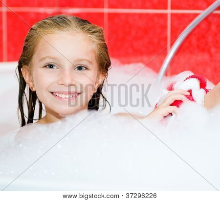 Little girl in the bath with a wisp