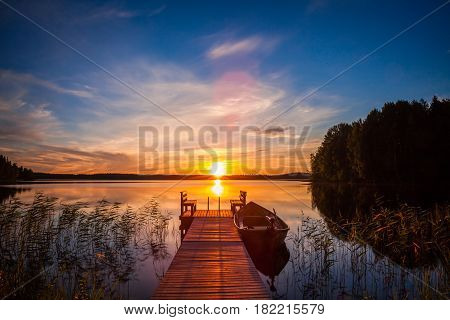 Sunset Over The Fishing Pier At The Lake In Finland