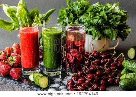 Strawberry smoothie. Detox water with cherries and green smoothie with ingredients. Healthy detox drinks