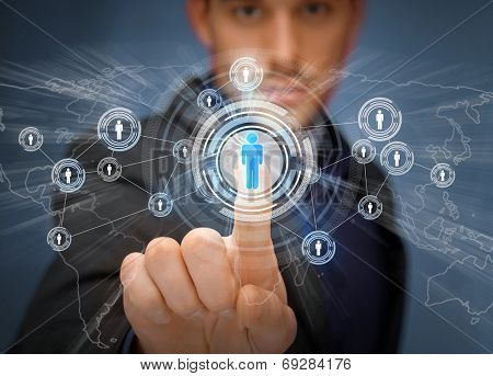 business, technology, internet and social networking concept - businessman pressing button with contact on virtual screens