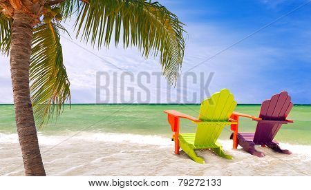 Panorama of colorful lounge chairs at a tropical  beach in Miami Florida