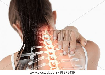 Digital composite of Highlighted spine of woman with neck pain