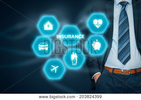 Insurance concept. Businessman with button and insurance icons: real estate insurance, car insurance, travel insurance, family and life insurance, financial insurance and health insurance.