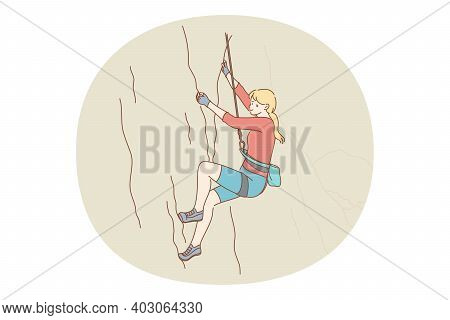 Alpinism And Climbing Concept. Young Girl Athlete Climbing Natural Mountains With Special Equipment 