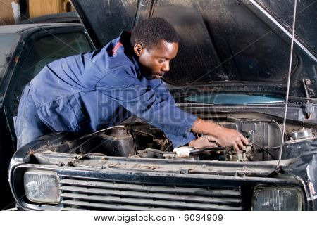 Mechanic fixing car