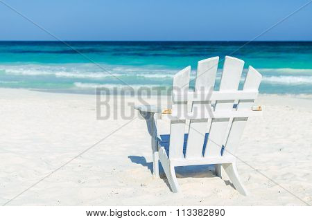 Tropical Resort View With Beach Chair Over Turquoise Sea At Exotic Sandy Beach