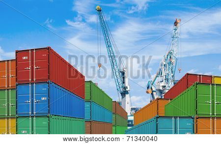 export or import shipping cargo container stacks and port cranes