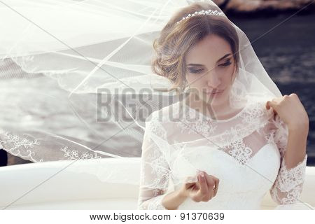 Beautiful Sensual Bride With Dark Hair In Luxurious Lace Wedding Dress