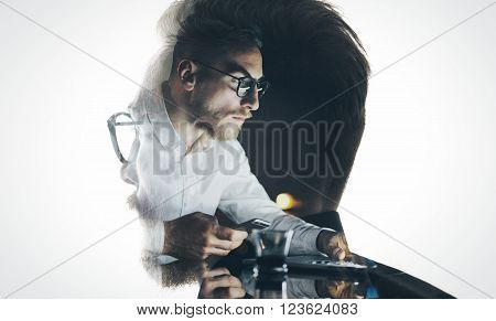 Portrait of stylish bearded lawyer wearing glasses and looking city. Double exposure, businessman working at night, texting smartphone background. Isolated white.