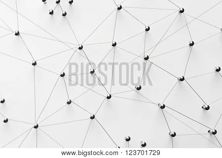 Linking entities. Network, networking, social media, connectivity, internet communication abstract. Top view. Web of thin silver wires on white background. 