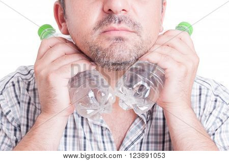 Man Cooling His Neck Using Cold Water Plastic Bottles