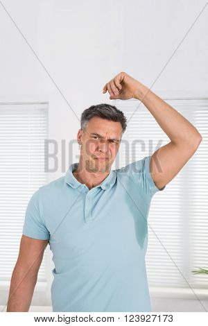 Man With Hyperhidrosis Sweating Very Badly Under Armpit At Home