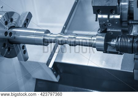 The  Cnc Lathe Machine Cutting The Metal Shaft Parts. The Hi-technology Metal Working Processing By 