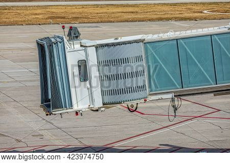 Passenger Boarding Bridge At The Airport Waiting For The Plane To Arrive