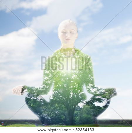 sport, fitness, yoga, double exposure and people concept - happy young woman meditating in lotus pose over blue sky and green tree background