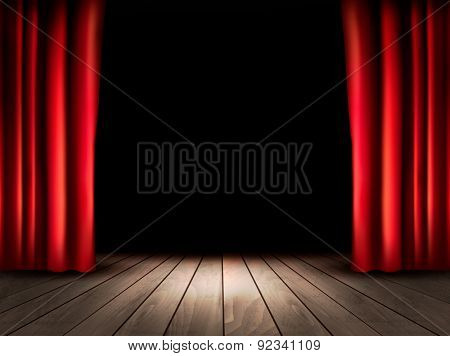 Theater stage with wooden floor and red curtains.