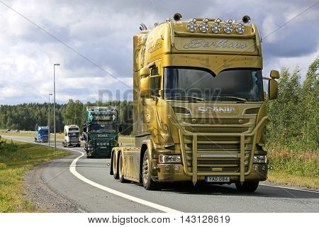 LEMPAALA, FINLAND - AUGUST 11, 2016: Berthons Scania Vikings V8 Longline 2016 moves along road as part of the truck convoy to the trucking event Power Truck Show 2016.