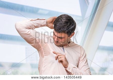 Business Man With Sweating Under Armpit In Office