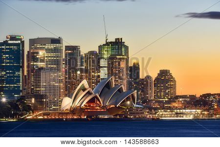 SYDNEY AUSTRALIA - August 212016: View Sydney CBD and The Opera House on sunset Sydney Australia Over 10 millions tourists visit Sydney every year