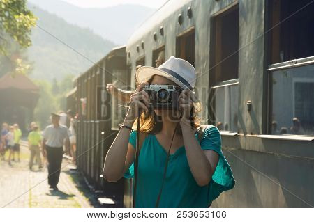 Traveler Girl Taking Photo In Train Station. Girl Traveling Alone In Train Station Taking Photo. Tra