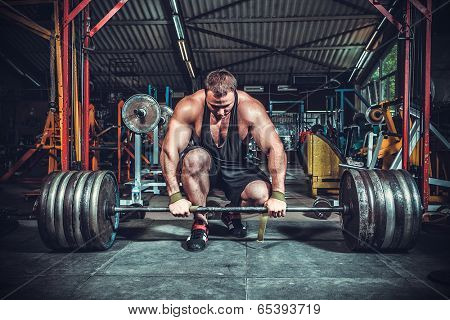 Powerlifter with strong arms lifting weights